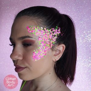 girl with neon coloured festival glitter makeup on her face chunky glitter supplies uk wholesale festival glitters