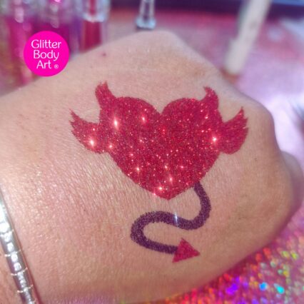 devil heart glitter tattoo stencil created with red and black glitter
