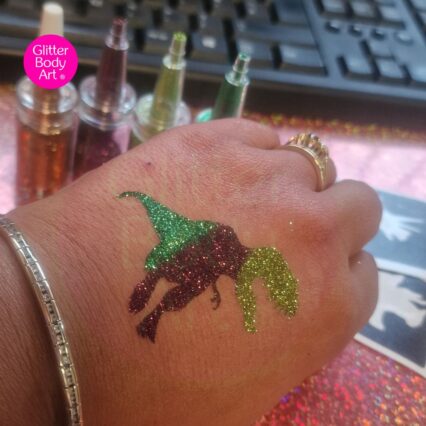 t-rex dinosaur glitter tattoo created with green and brown glitter